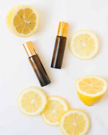 essential oil roller bottles and lemons