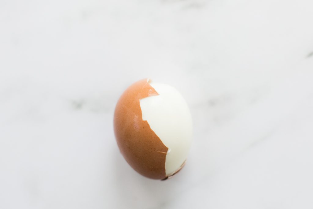 A farm fresh backyard chicken egg that is easy being peeled easily.  