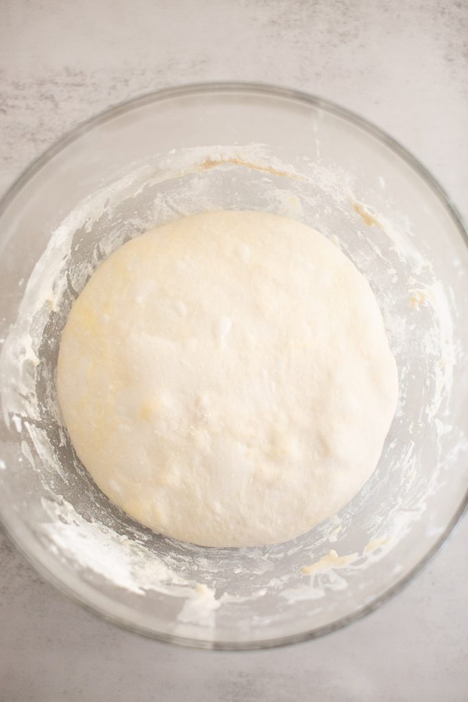 sourdough croissant loaf that has been shaped and placed in a bowl