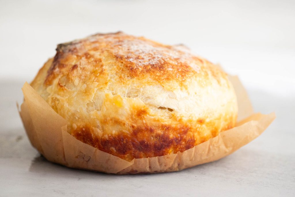 a loaf of sourdough croissant bread on a table