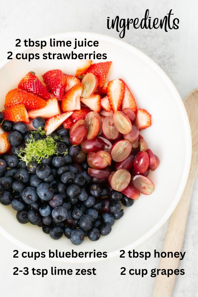 ingredients for honey lime fruit salad: honey, lime juice, blueberries, grapes, lime zest and strawberries