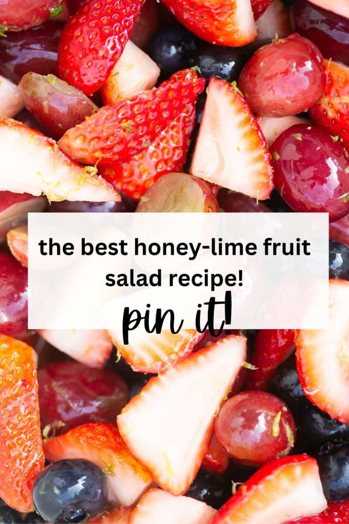 a pinterest pin with a photo of honey lime fruit salad: strawberries, grapes, blueberries, honey and lime zest.