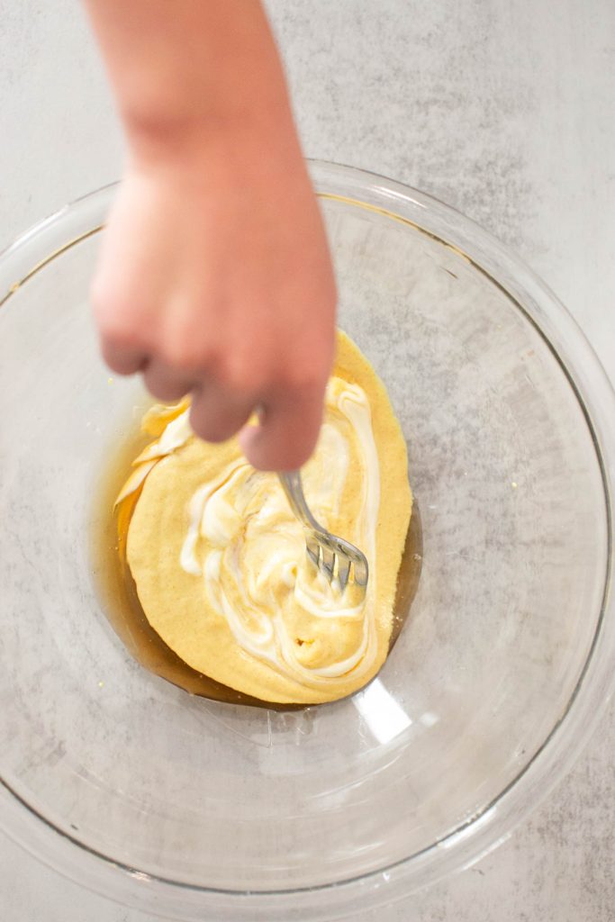 honey, mayo and dijon mustard being mixed in a small bowl