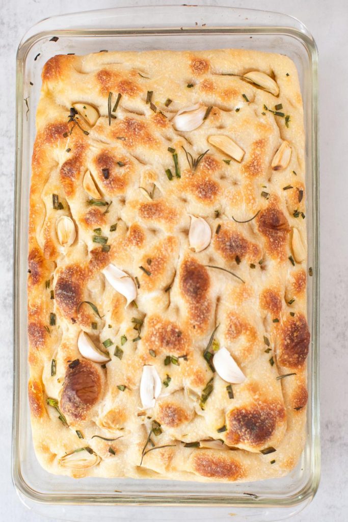 sourdough focaccia bread in a glass pan