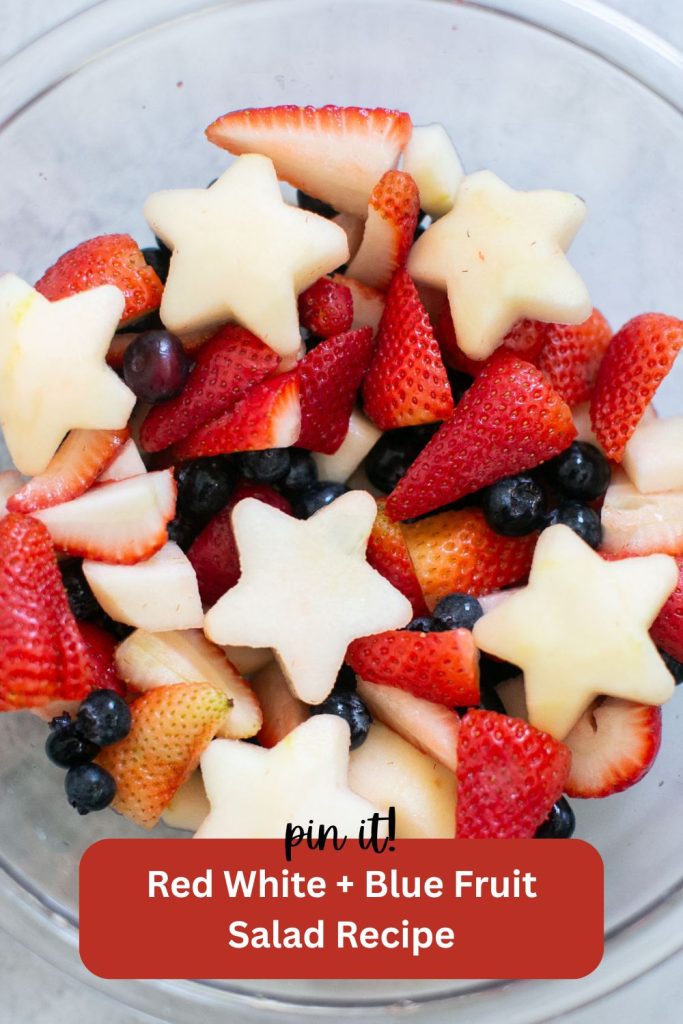 a pinterest pin with a photo of a 4th of July salad: white pears, red strawberries and blue berries in a bowl