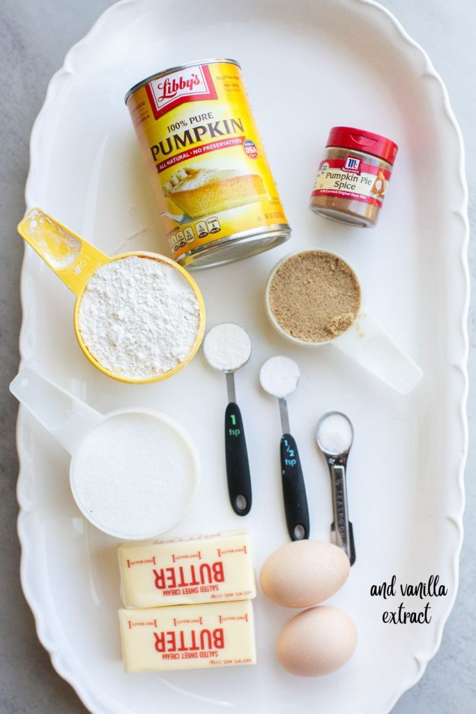 ingredients for the best pumpkin streusel muffins on a plate: pure pumpkin, flour, salt, baking soda, baking powder, pumpkin pie spice, flour, sugar, vanilla extract, butter