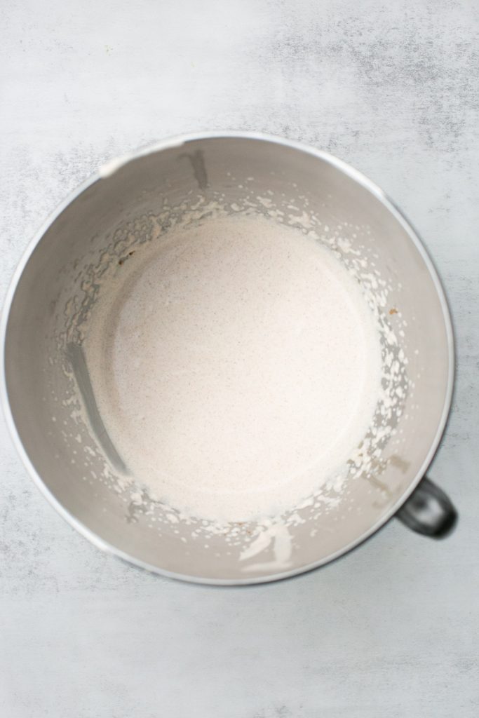 whipped cream, pumpkin pie spice, vanilla and sugar being whipped in a bowl