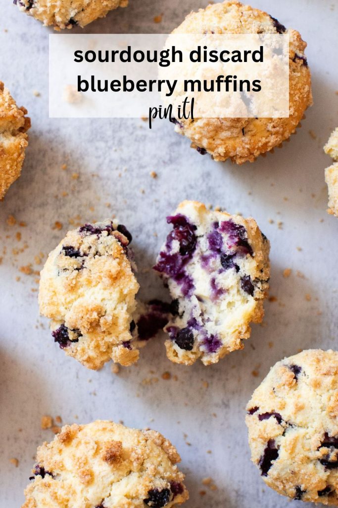 a pinterest pin with a photo of sourdough discard blueberry muffins that have a crumb topping