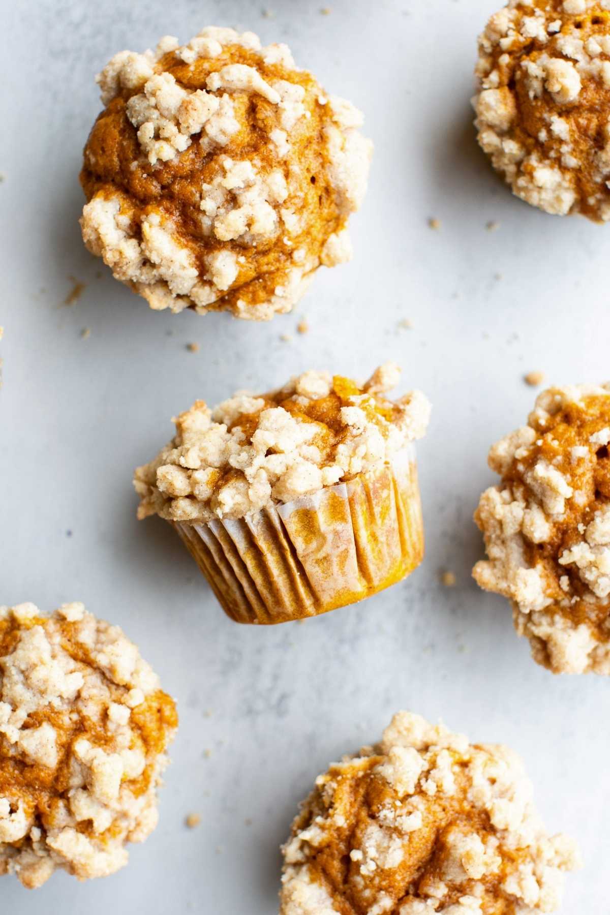 Sourdough discard pumpkin muffins with streusel topping on a tray.