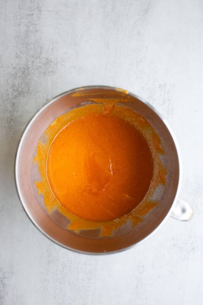 wet ingredients in a bowl for sourdough discard pumpkin streusel muffins.
