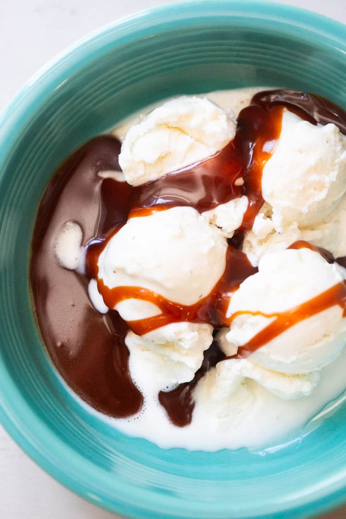 3 ingredient caramel sauce made with heavy whipping cream drizzled over vanilla ice cream 