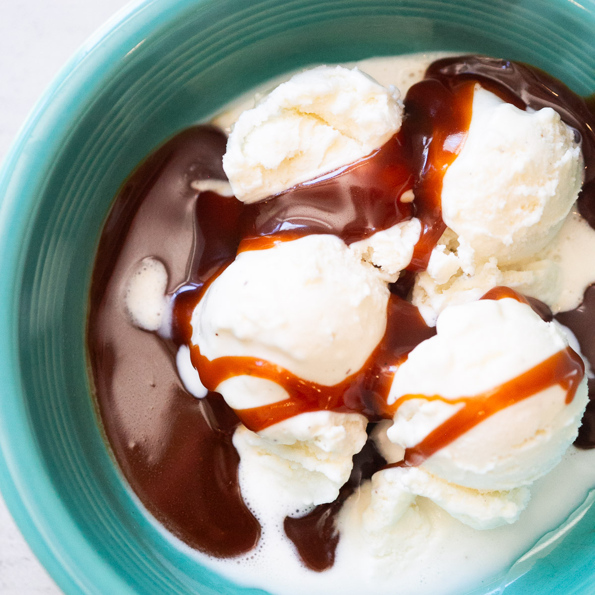 3 ingredient caramel sauce poured over ice cream