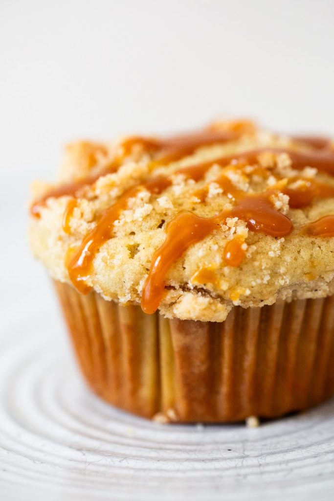 homemade caramel drizzled over a caramel apple muffin