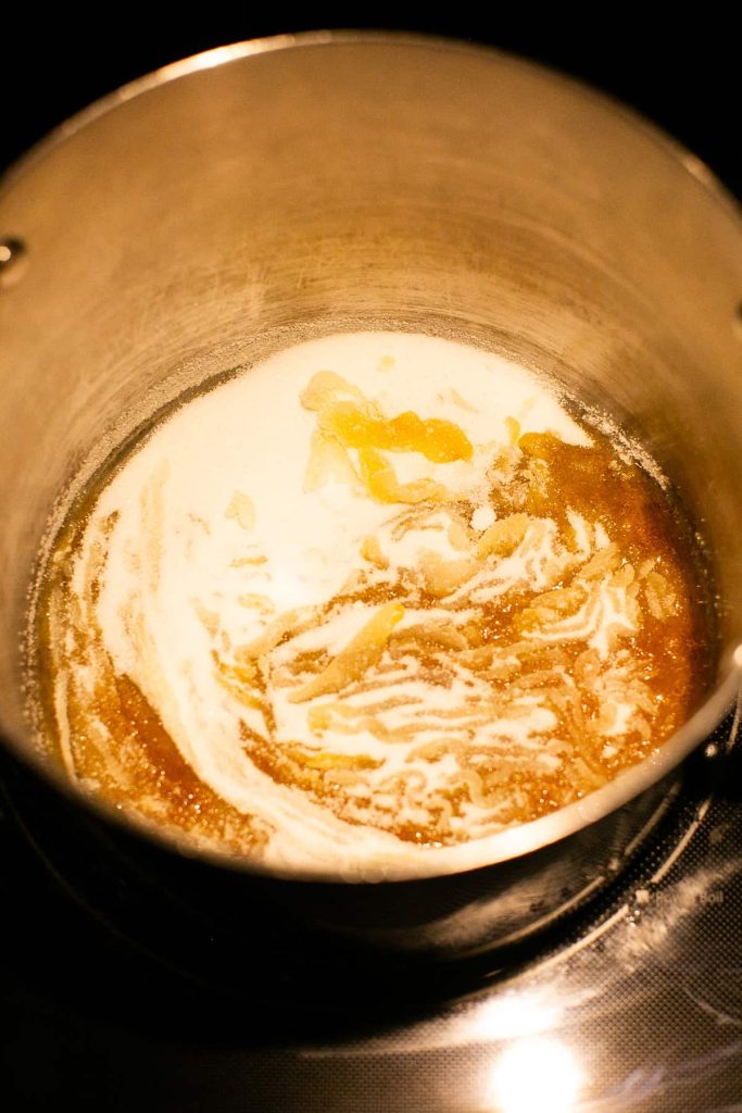sugar being heated in a pot for caramel sauce