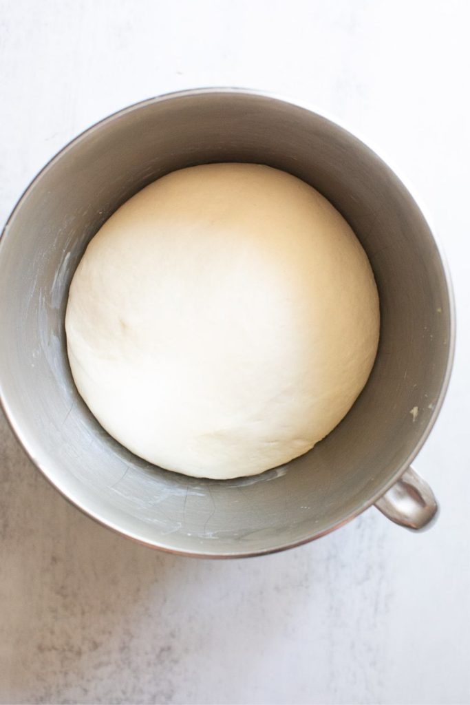 dough for sourdough discard sandwich bread in the bowl of a stand mixer