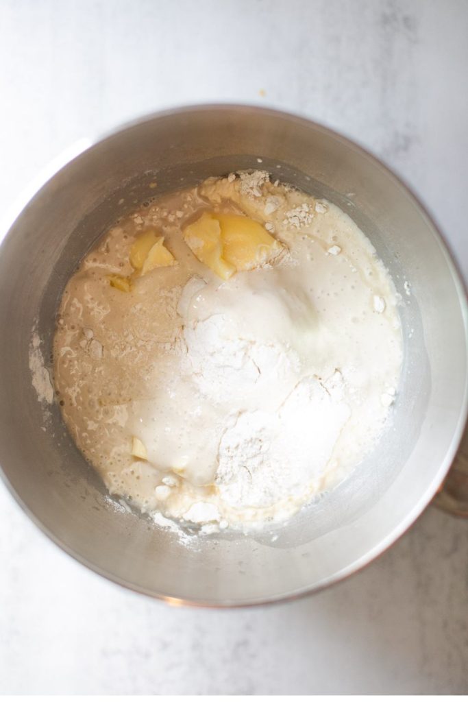 butter, flour, sourdough discard and salt added to wet ingredients in the bowl of a stand mixer