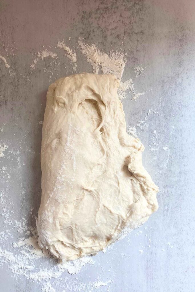 Dough for sourdough sandwich bread on a countertop.