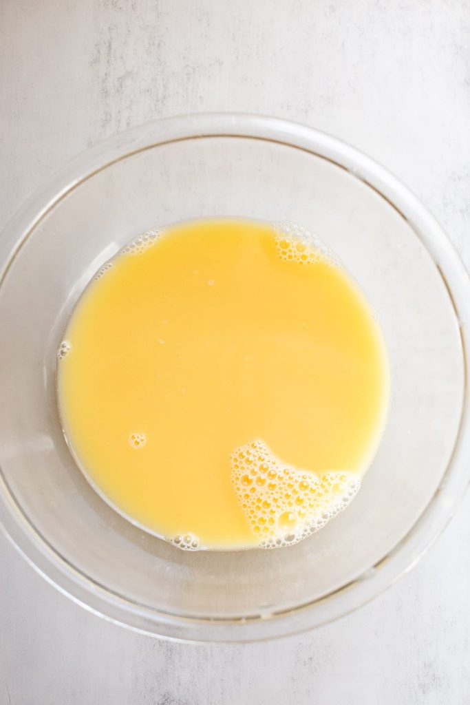 egg and chicken stock in a bowl together