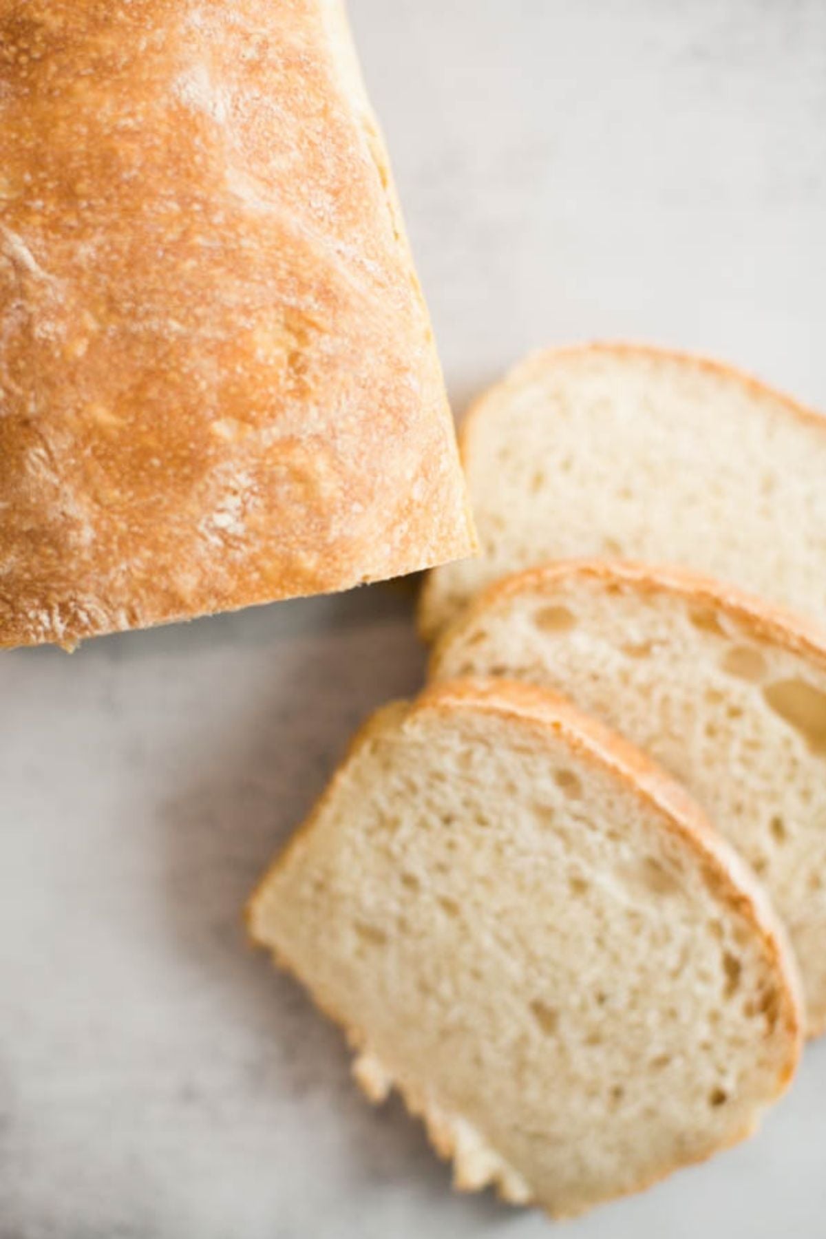 Sourdough sandwich bread sitting on a table.