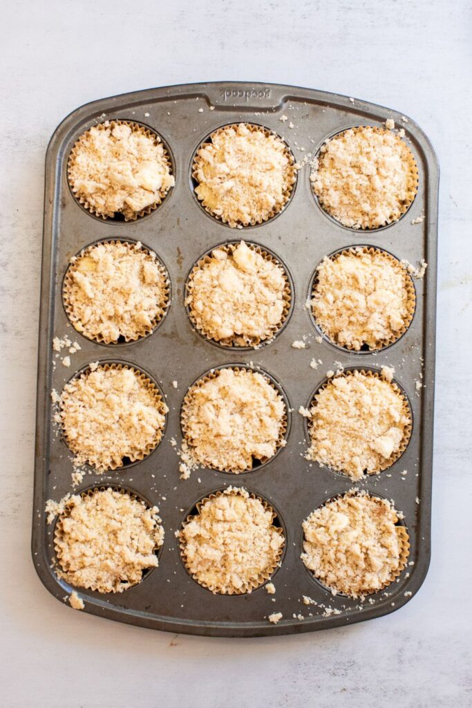 sourdough discard caramel apple muffins in a baking pan