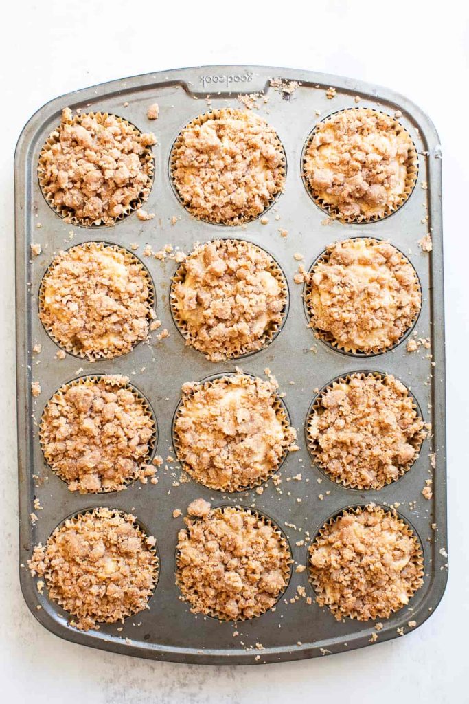 sourdough discard apple muffins in a muffin tin