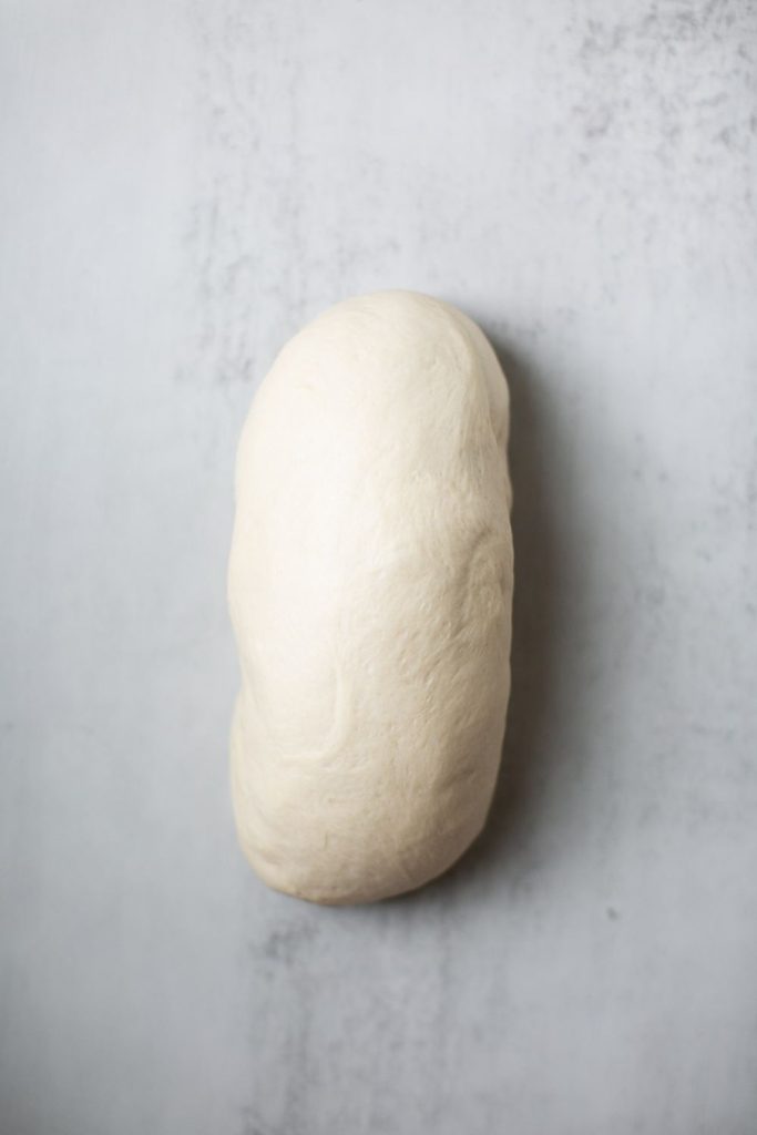 sourdough discard sandwich bread dough shaped rolled into a tight log