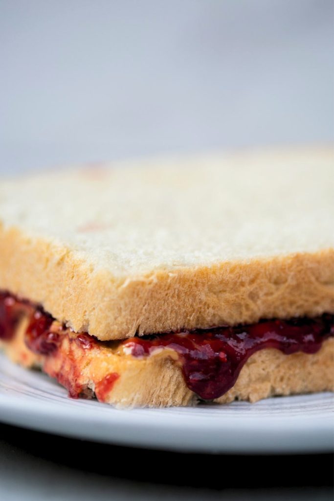 peanut butter and jelly sandwich made with sourdough discard sandwich bread
