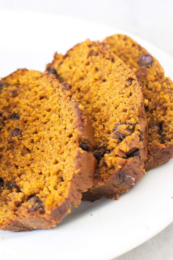chocolate chip pumpkin bread sliced on a plate