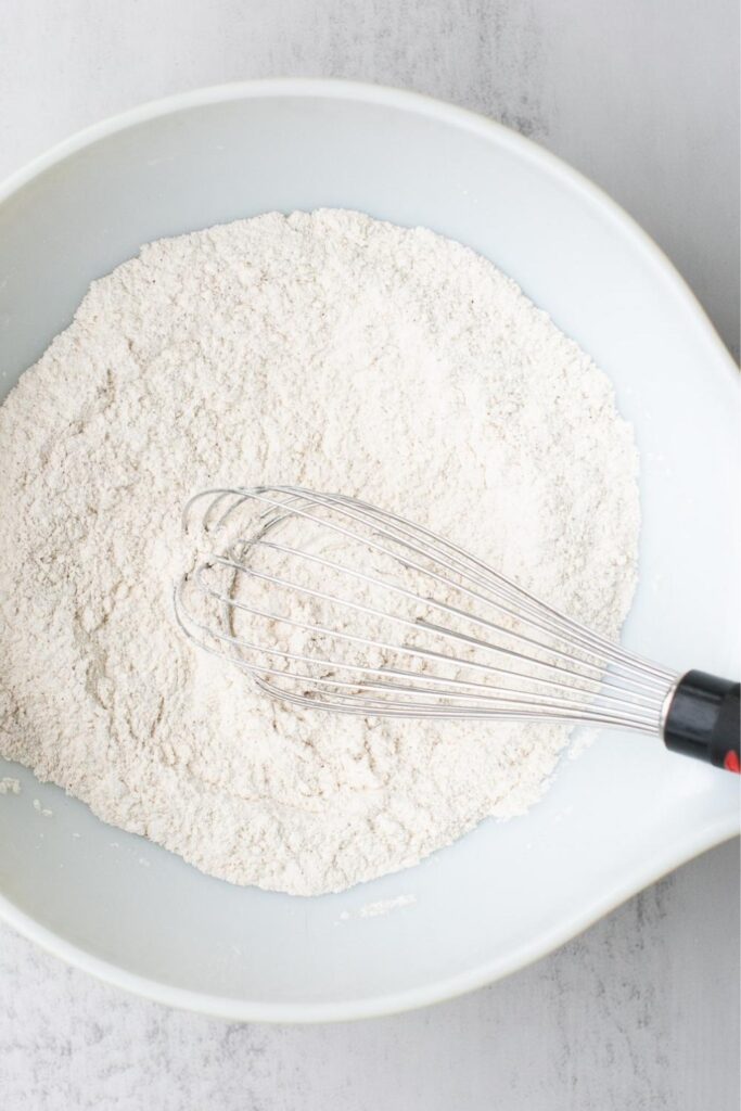 dry ingredients for sourdough molasses cookies whisked in a bowl