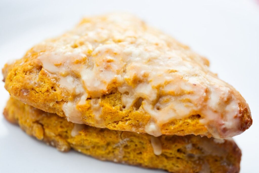 sourdough discard pumpkin scones with maple glaze frosting
