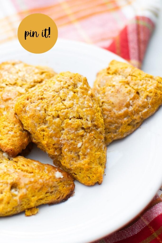 a pinterest pin with a photo of a sourdough discard pumpkin scone with maple glaze