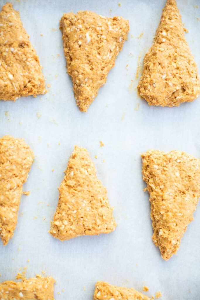 cut sourdough scones on a baking sheet