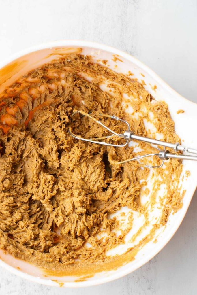 wet ingredients for sourdough molasses cookies beaten in a bowl