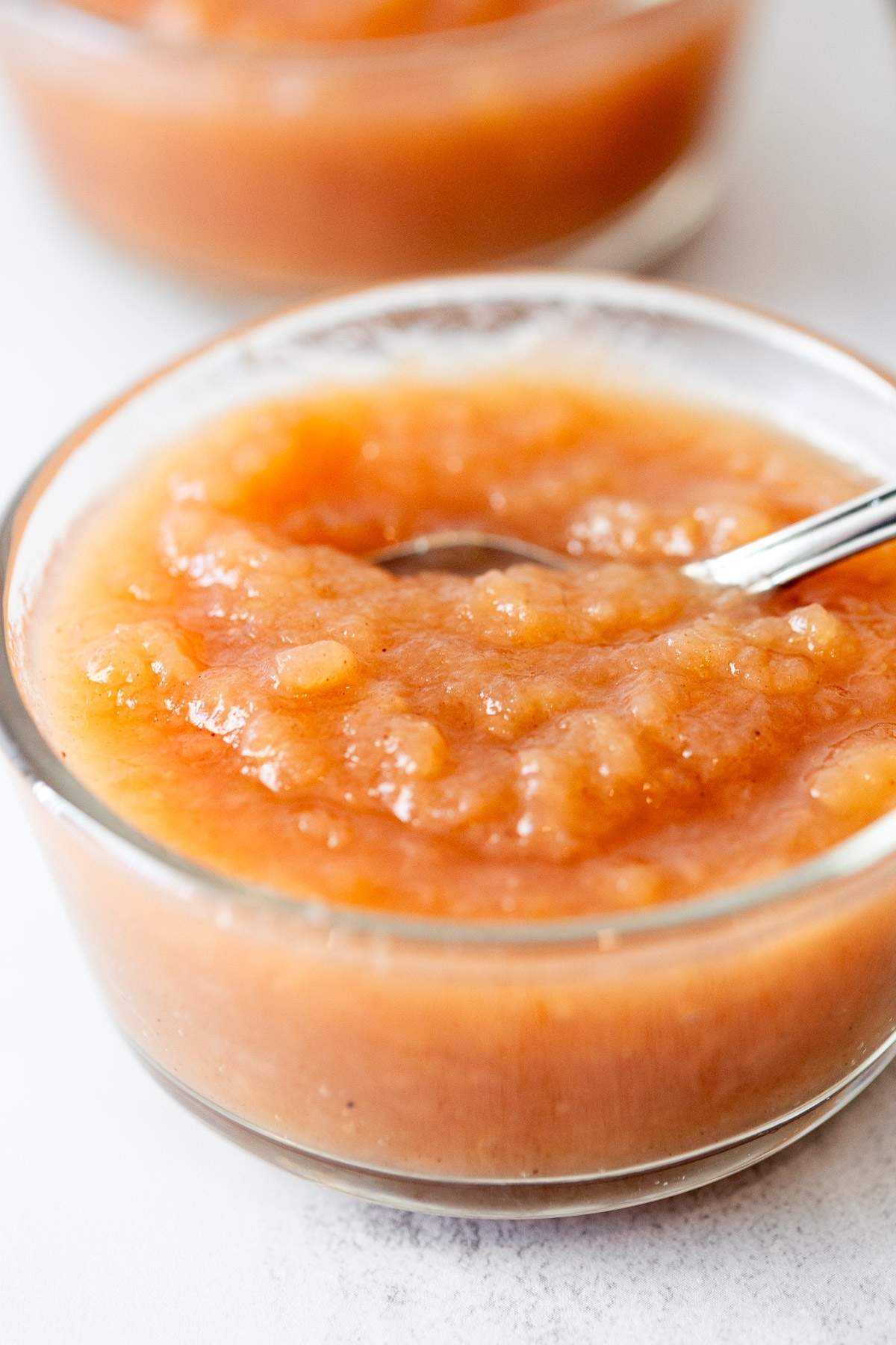homemade applesauce in a small dish on a table. 
