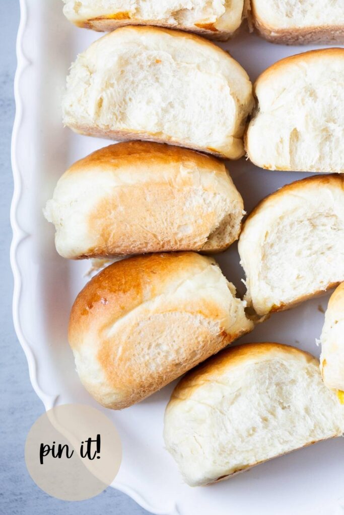 soft and fluffy sourdough discard sandwich rolls on a plate