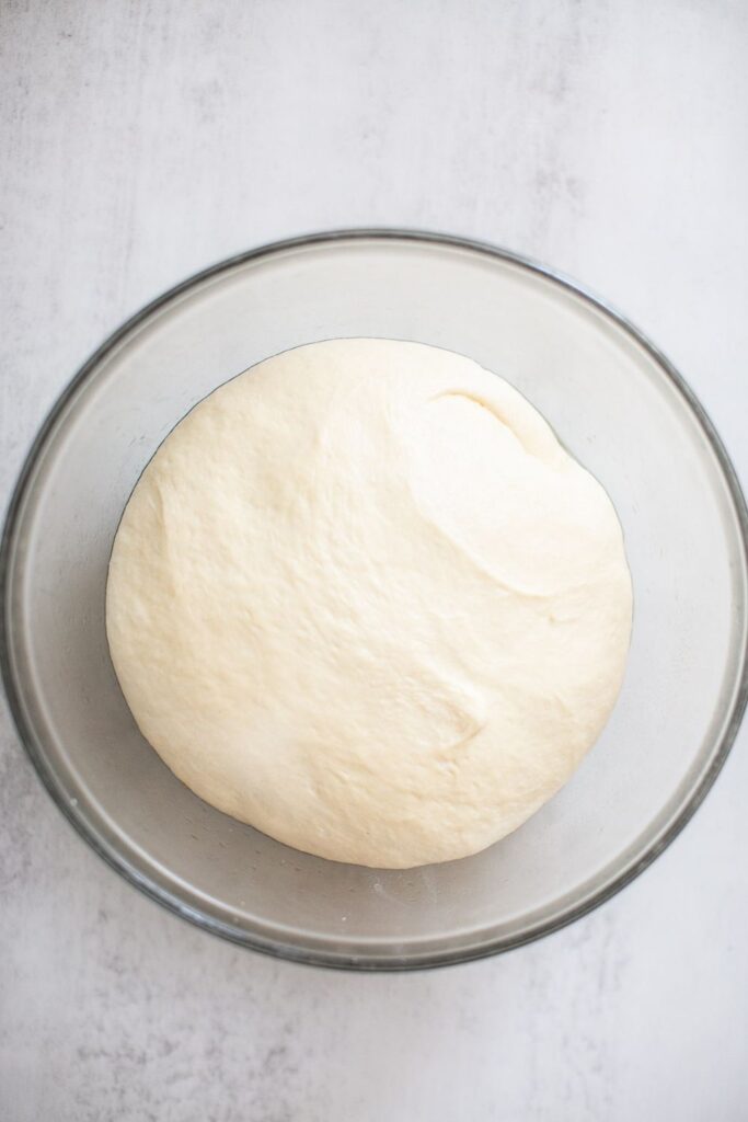 sourdough discard sandwich bread dough in a bowl after bulk ferment