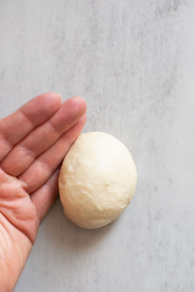 sourdough discard roll bread rolled into a ball