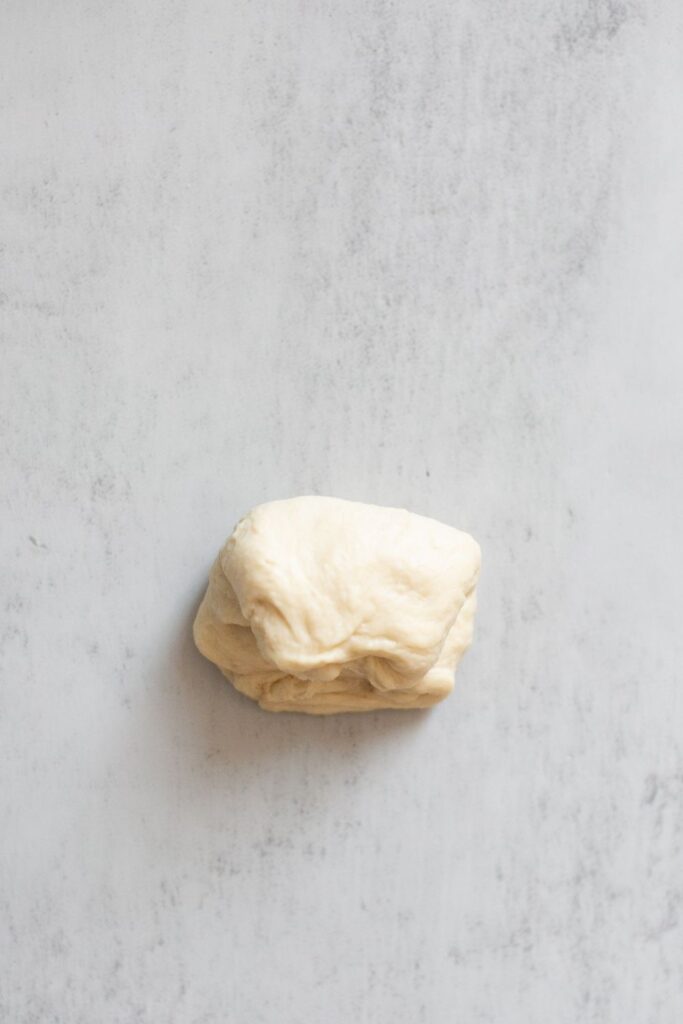 sourdough discard roll bread rolled into a ball
