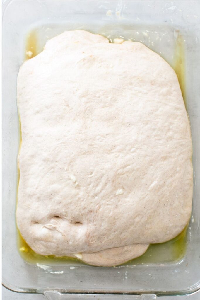 fermented sourdough cinnamon roll focaccia in a dish