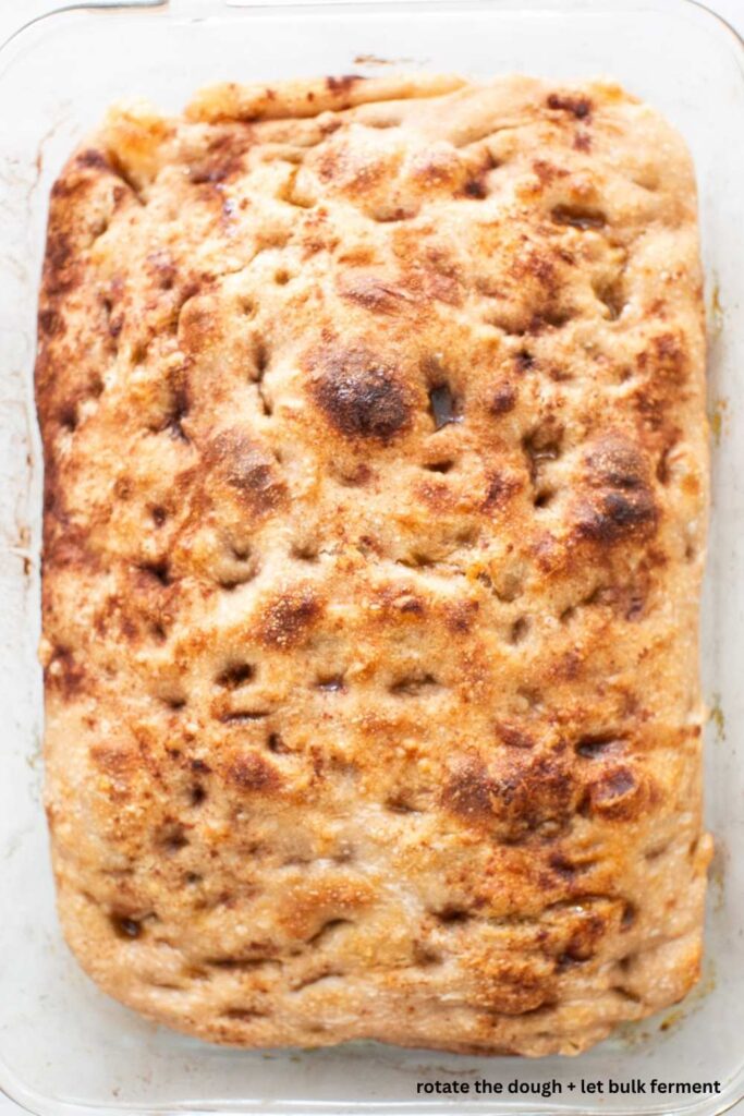 sourdough cinnamon roll focaccia in a 9x13 glass pan after baking