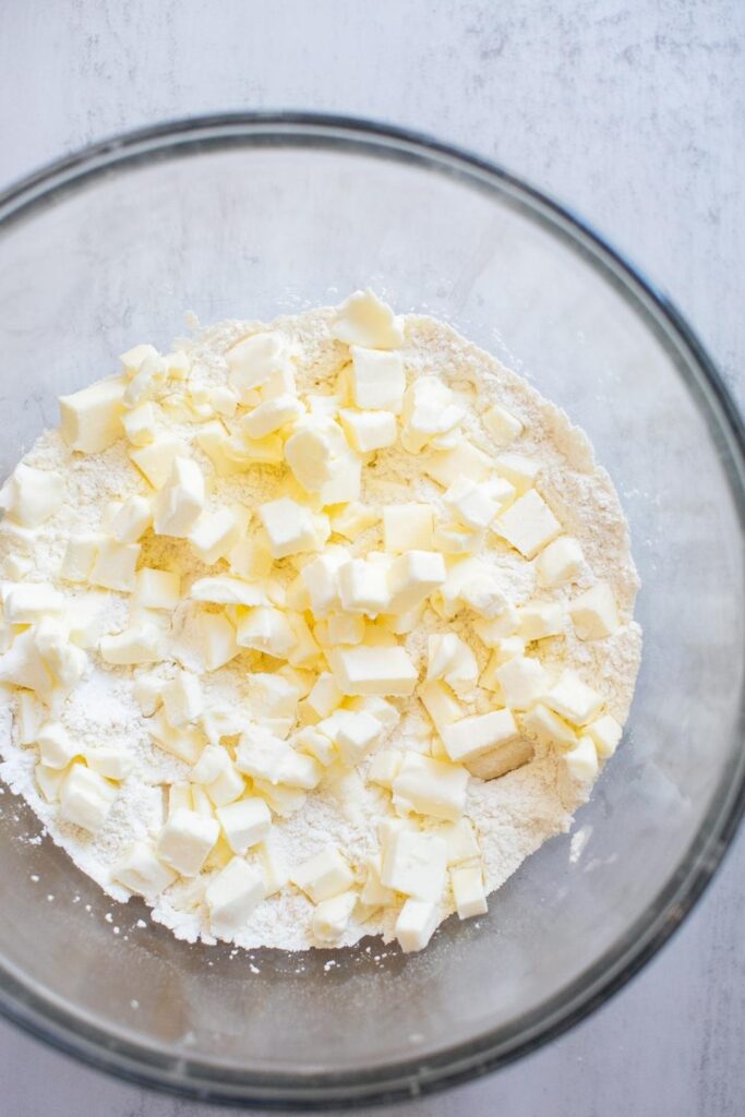all purpose flour and chunks of butter in a bowl for pie dough