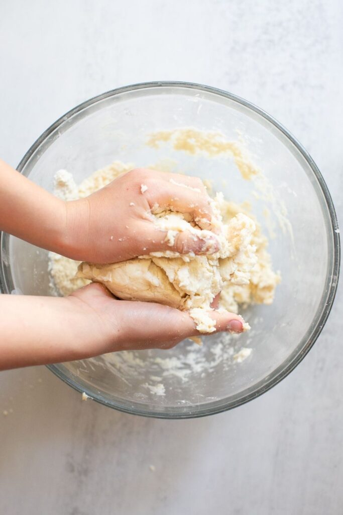 sourdough pie dough being formed into a disc