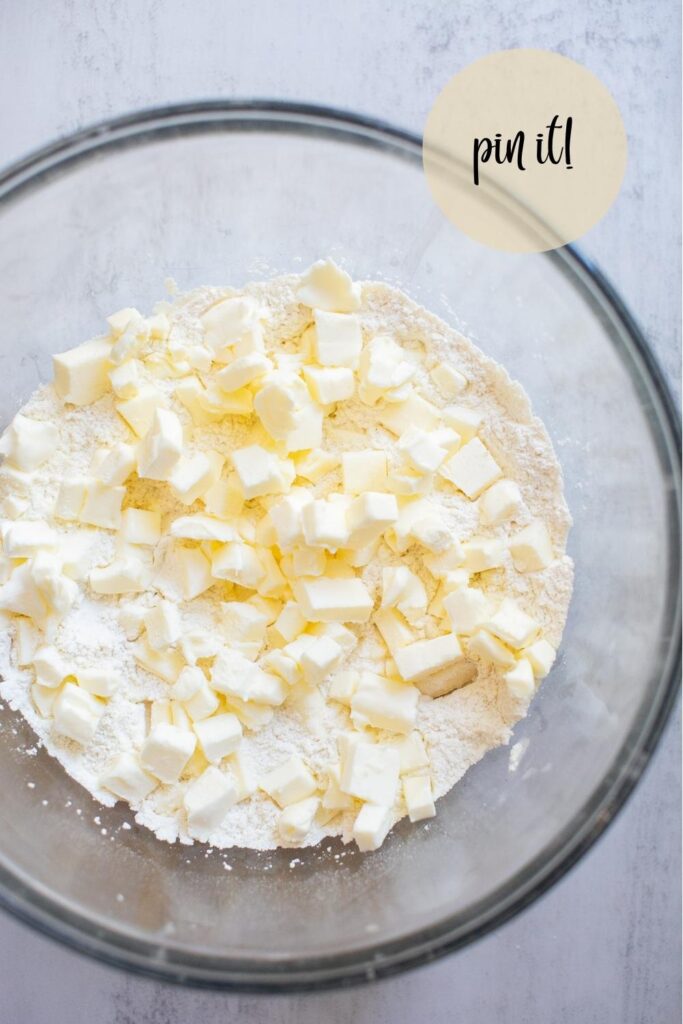 butter and flour in a bowl for sourdough discard pie crust