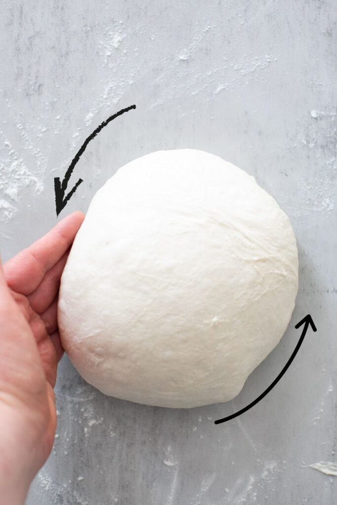 tension being added to unloaf sourdough bread when shaping