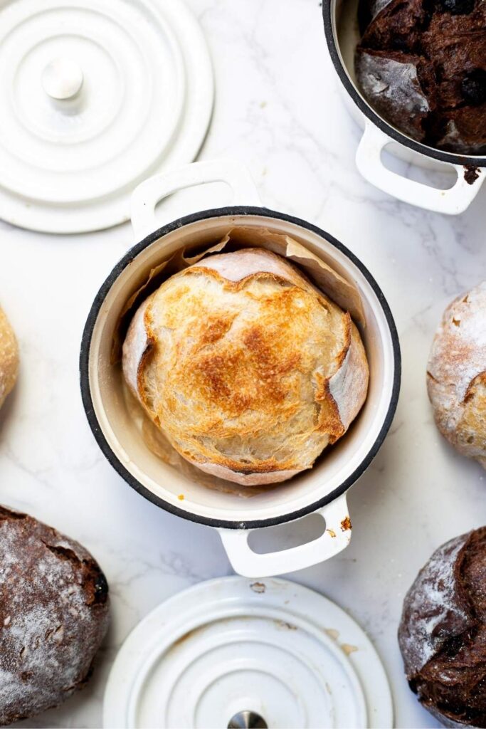 a mini sourdough loaf in a dutch oven