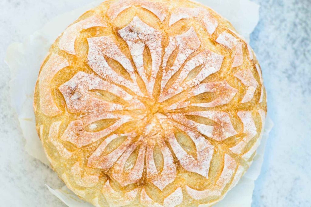 sourdough snowflake bread score on a table