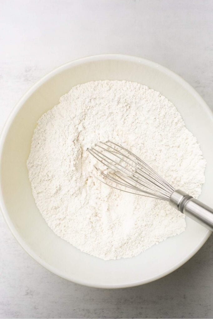 Dry ingredients in a bowl for sourdough discard sugar cookies.