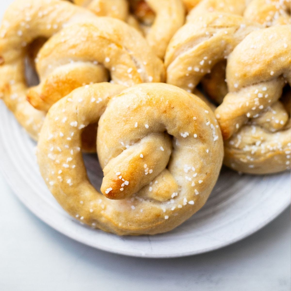 homemade overnight sourdough pretzels on a plate