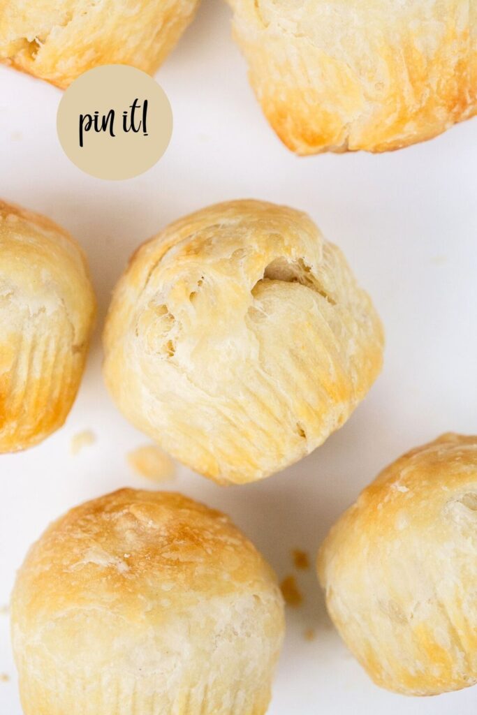 sourdough croissant bread rolls on a tray