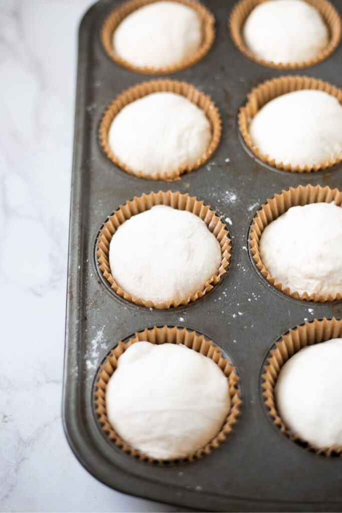 sourdough croissant bread roll dough in a cupcake tin